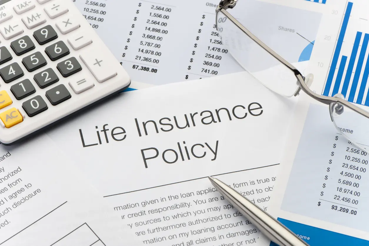 Life insurance policy document with calculator and charts