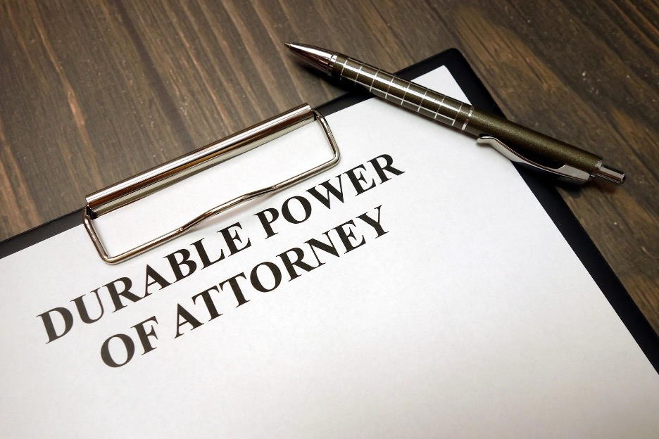 Durable power of attorney document with pen and clip