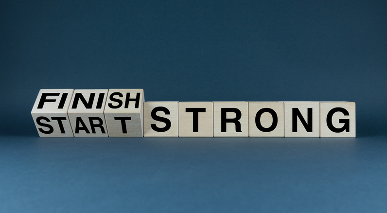 Blocks spelling 'Finish Strong Start Strong' on blue background