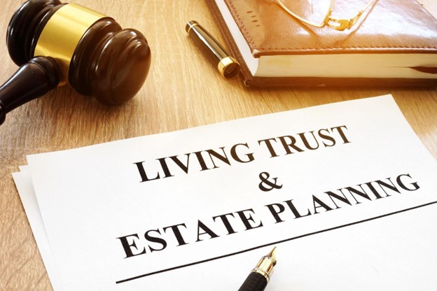 Living trust and estate planning documents with gavel